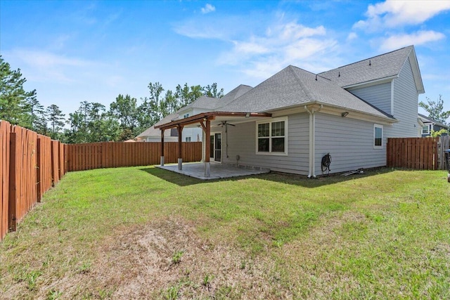 1404 Feldspar Ct, Augusta, GA 30909 - rear view of house featuring ceiling fan, a patio area, roof with shingles, and a fenced backyard