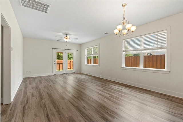1404 Feldspar Ct, Augusta, GA 30909 - spare room featuring wood finished floors, a chandelier, and ceiling fan