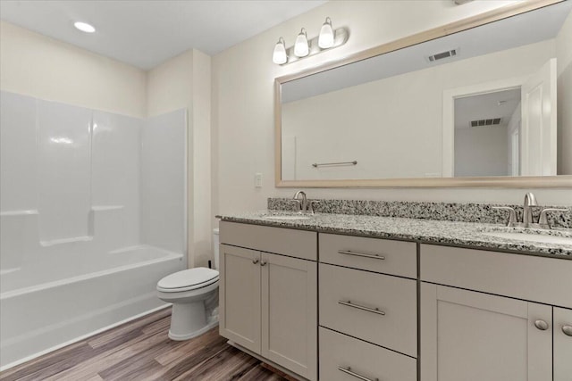 1404 Feldspar Ct, Augusta, GA 30909 - full bathroom with wood finished floors, double vanity, shower / bath combination, and recessed lighting