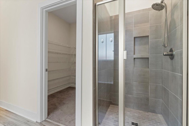 1404 Feldspar Ct, Augusta, GA 30909 - full bathroom with a stall shower, a spacious closet, and wood finished floors