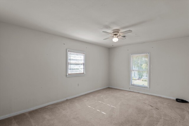 223 E Robert Toombs Ave, Washington, GA 30673 - spare room with ceiling fan, baseboards, and light colored carpet