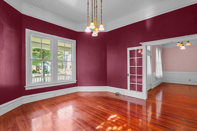 223 E Robert Toombs Ave, Washington, GA 30673 - empty room with a chandelier, hardwood / wood-style floors, ornamental molding, and wainscoting
