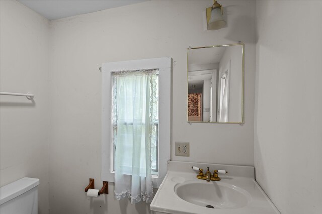 223 E Robert Toombs Ave, Washington, GA 30673 - bathroom featuring toilet and vanity