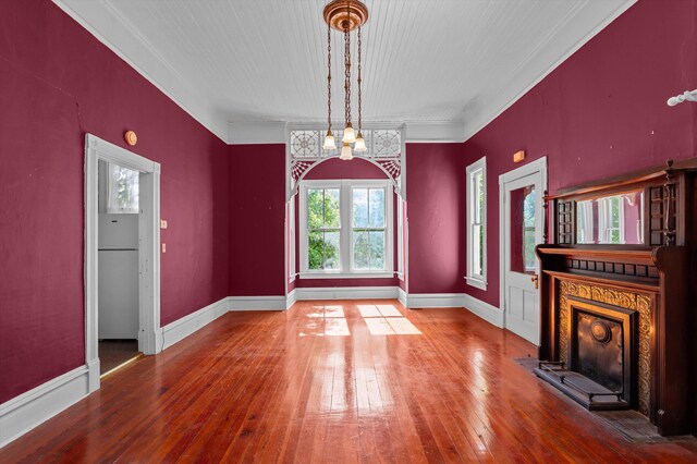 223 E Robert Toombs Ave, Washington, GA 30673 - unfurnished dining area with hardwood / wood-style floors, a high end fireplace, baseboards, and crown molding