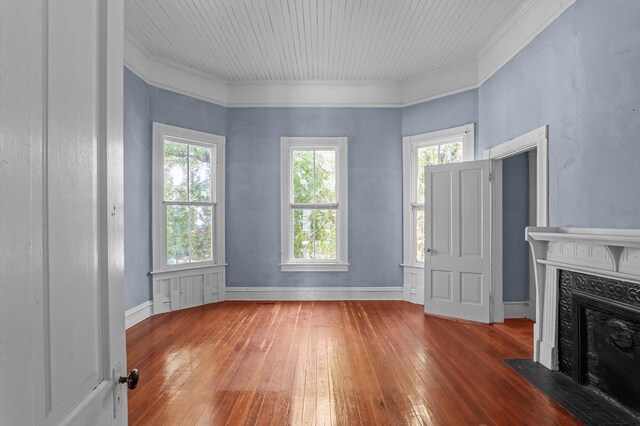 223 E Robert Toombs Ave, Washington, GA 30673 - unfurnished living room with hardwood / wood-style flooring, a high end fireplace, and ornamental molding