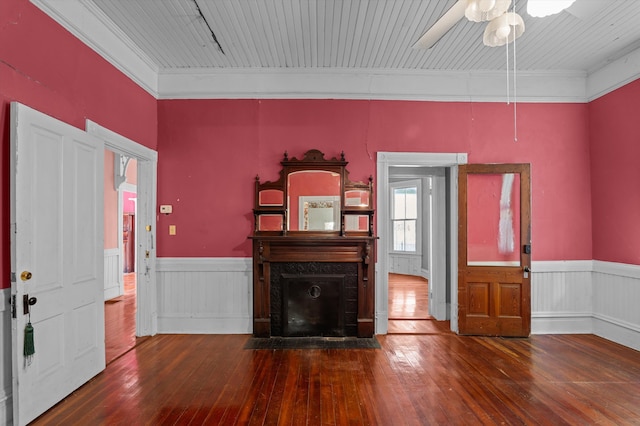 223 E Robert Toombs Ave, Washington, GA 30673 - foyer featuring a wainscoted wall, wood-type flooring, a ceiling fan, crown molding, and a fireplace with flush hearth