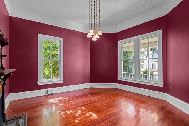 223 E Robert Toombs Ave, Washington, GA 30673 - empty room featuring hardwood / wood-style flooring, ornamental molding, and a chandelier