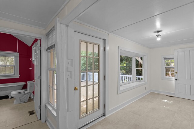 223 E Robert Toombs Ave, Washington, GA 30673 - doorway with plenty of natural light, light tile patterned flooring, and baseboards