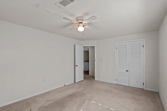 223 E Robert Toombs Ave, Washington, GA 30673 - unfurnished bedroom featuring carpet flooring, baseboards, a closet, and washer / dryer