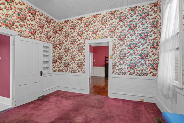 223 E Robert Toombs Ave, Washington, GA 30673 - carpeted spare room featuring wallpapered walls, wainscoting, and crown molding