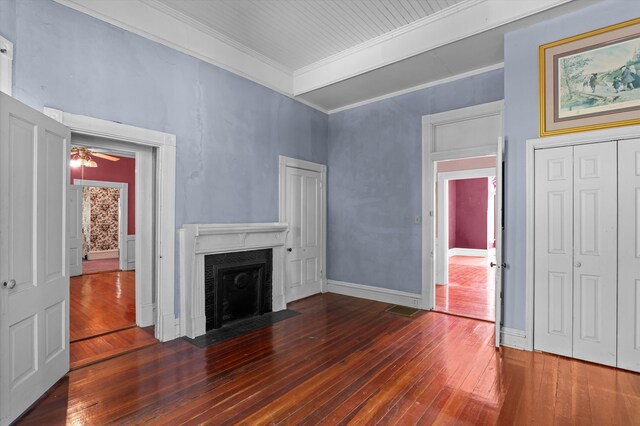 223 E Robert Toombs Ave, Washington, GA 30673 - unfurnished living room with hardwood / wood-style floors, a premium fireplace, crown molding, and baseboards