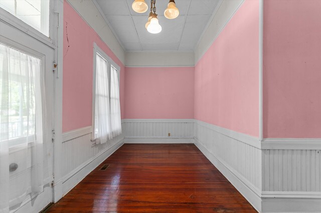 223 E Robert Toombs Ave, Washington, GA 30673 - unfurnished room with wainscoting, wood-type flooring, and a chandelier
