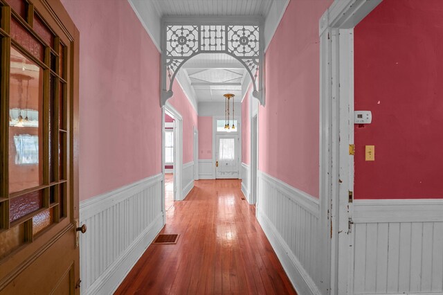 223 E Robert Toombs Ave, Washington, GA 30673 - hallway featuring a wainscoted wall, wood-type flooring, and arched walkways