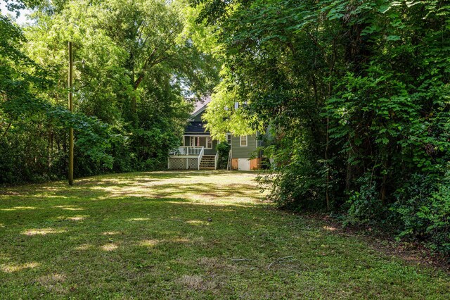 223 E Robert Toombs Ave, Washington, GA 30673 - view of grassy yard featuring a wooden deck and stairway