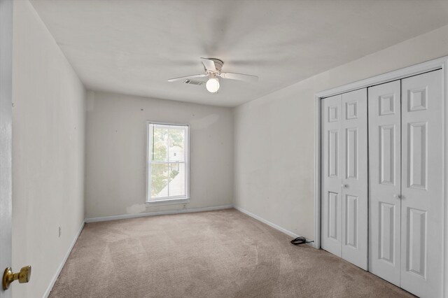 223 E Robert Toombs Ave, Washington, GA 30673 - unfurnished bedroom with carpet, a closet, baseboards, and ceiling fan