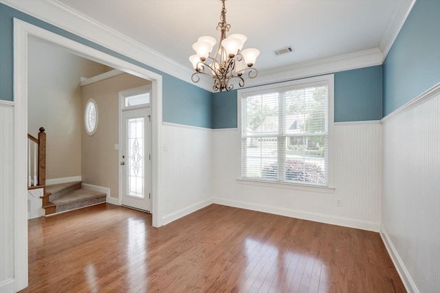 1102 Highmoor Ln, Evans, GA 30809 - foyer with a chandelier, stairway, wood finished floors, a wainscoted wall, and crown molding