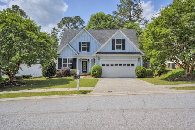 1102 Highmoor Ln, Evans, GA 30809 - view of front of house with concrete driveway, a shingled roof, a front lawn, board and batten siding, and a garage
