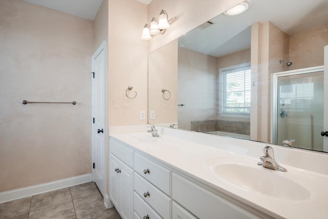 1102 Highmoor Ln, Evans, GA 30809 - bathroom featuring a shower stall, double vanity, tile patterned flooring, and baseboards