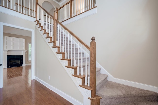 1102 Highmoor Ln, Evans, GA 30809 - staircase featuring wood finished floors, baseboards, and a tile fireplace