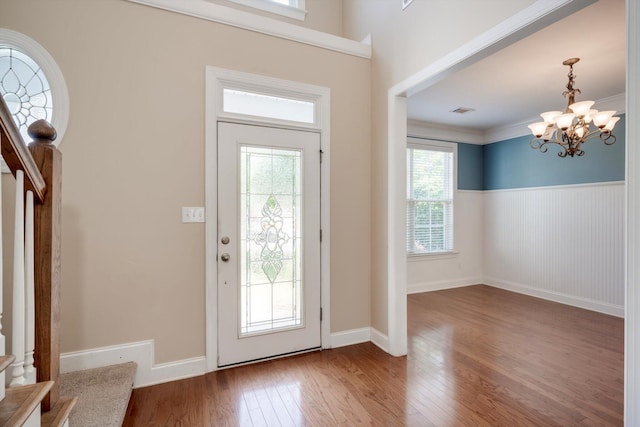 1102 Highmoor Ln, Evans, GA 30809 - foyer entrance featuring hardwood / wood-style flooring, a chandelier, a wainscoted wall, crown molding, and stairway