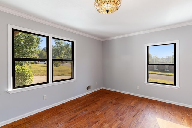 3413 Sutton Pl, Augusta, GA 30906 - spare room featuring visible vents, wood finished floors, baseboards, and crown molding
