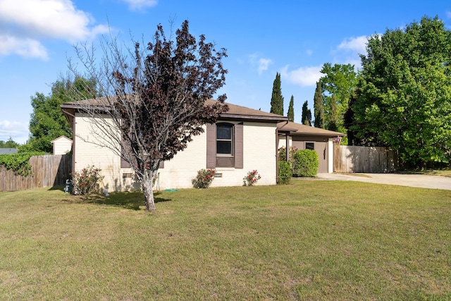 3413 Sutton Pl, Augusta, GA 30906 - view of home's exterior featuring fence, a lawn, and concrete driveway