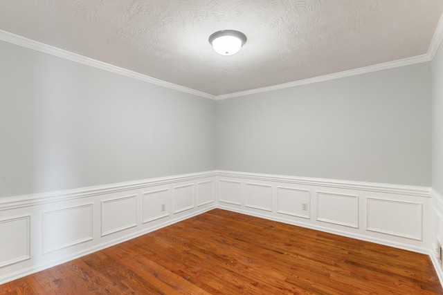 3413 Sutton Pl, Augusta, GA 30906 - unfurnished room featuring wood finished floors, a textured ceiling, crown molding, and a wainscoted wall