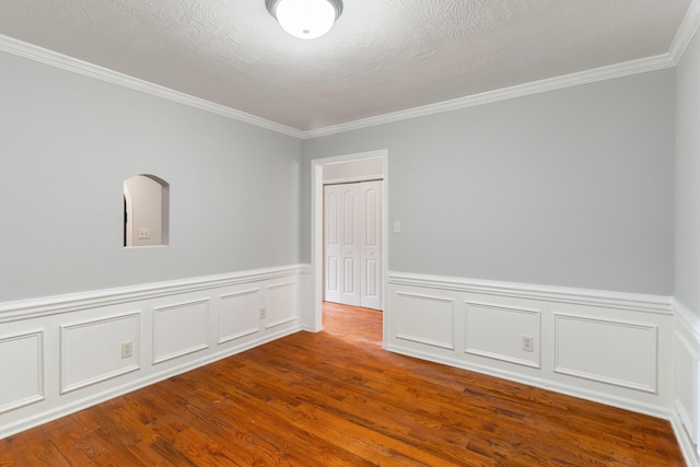 3413 Sutton Pl, Augusta, GA 30906 - spare room featuring wood finished floors, a wainscoted wall, and ornamental molding