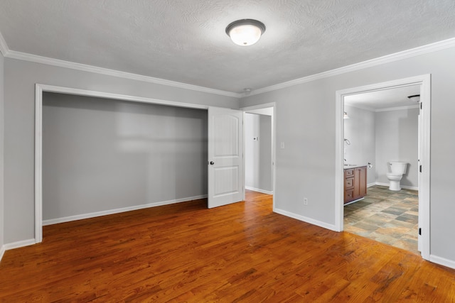 3413 Sutton Pl, Augusta, GA 30906 - unfurnished bedroom featuring a textured ceiling, wood finished floors, a closet, and ornamental molding
