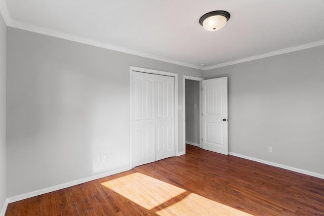 3413 Sutton Pl, Augusta, GA 30906 - unfurnished bedroom featuring wood finished floors, a closet, crown molding, and baseboards