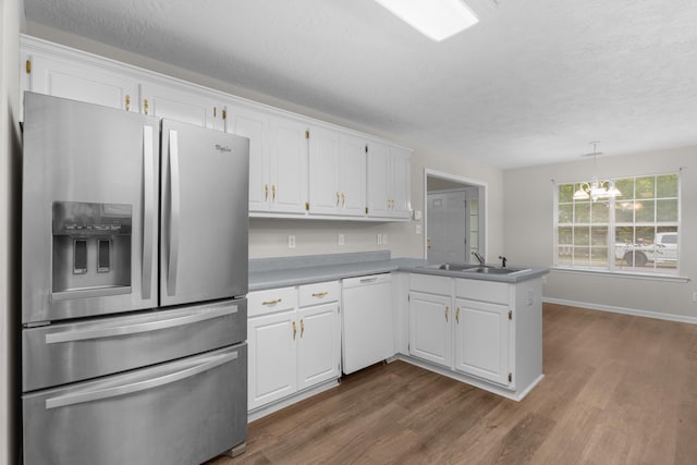 159 Redbud Dr, North Augusta, SC 29841 - kitchen featuring stainless steel fridge with ice dispenser, dishwasher, white cabinetry, a peninsula, and dark wood-style floors