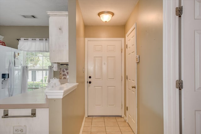 8030 Reagan Cir, Augusta, GA 30909 - entryway featuring light tile patterned floors and baseboards
