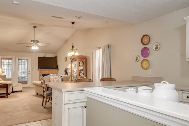8030 Reagan Cir, Augusta, GA 30909 - kitchen featuring lofted ceiling, light carpet, light countertops, hanging light fixtures, and a ceiling fan