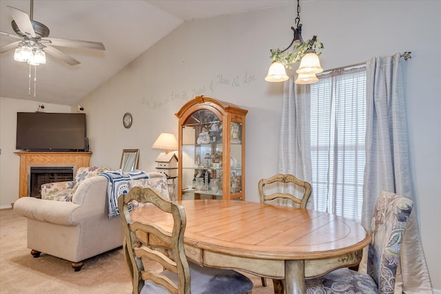 8030 Reagan Cir, Augusta, GA 30909 - dining space with lofted ceiling, a ceiling fan, carpet floors, and a fireplace