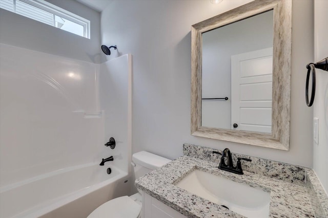 bathroom with shower / bath combination, vanity, and toilet