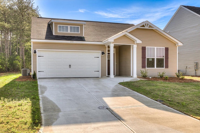 view of front of house featuring an attached garage, central AC, a shingled roof, driveway, and a front yard