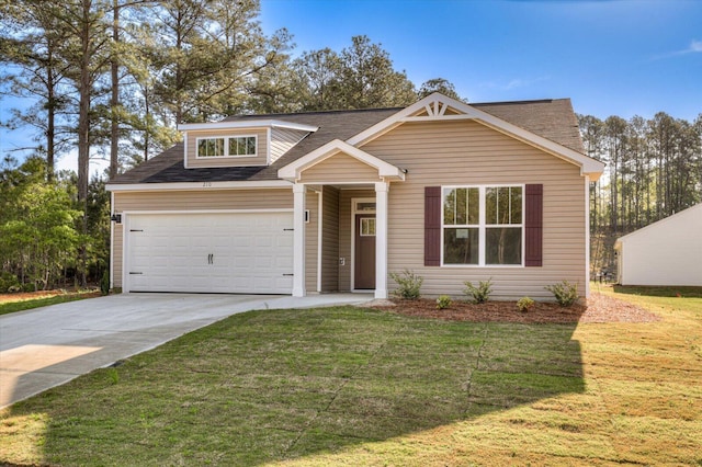 view of front facade with a garage, concrete driveway, and a front yard