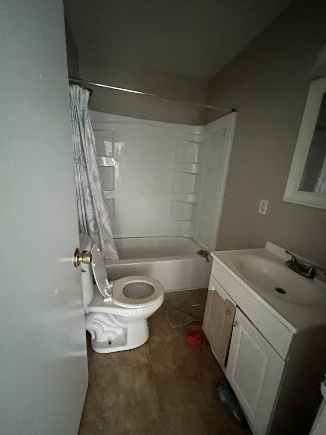 bathroom featuring toilet, shower / bath combo, and vanity