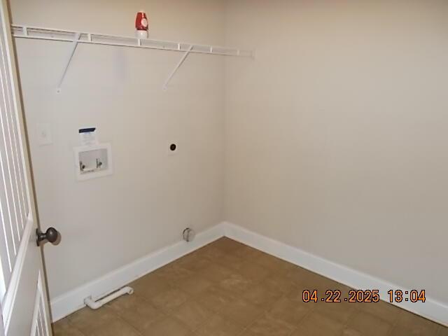 washroom featuring washer hookup, baseboards, and laundry area