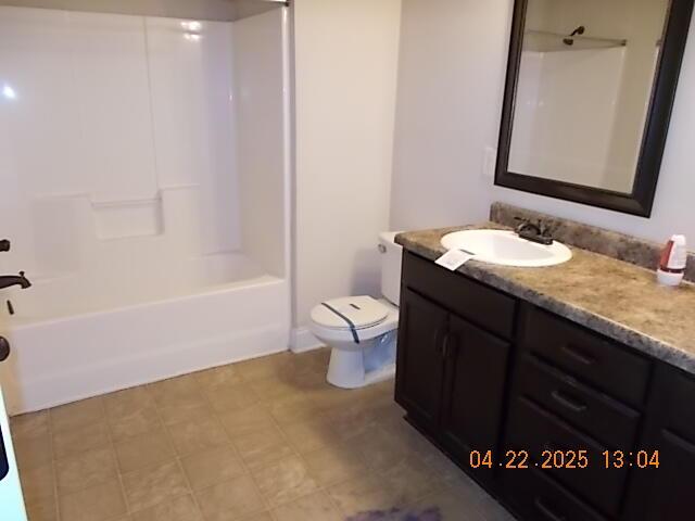 full bathroom with vanity, bathing tub / shower combination, and toilet