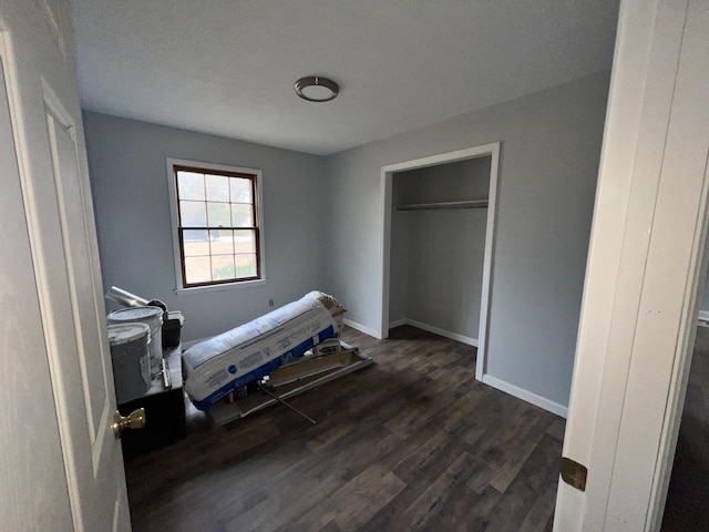 bedroom featuring dark wood-type flooring