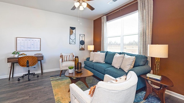 living room with ceiling fan and dark hardwood / wood-style floors