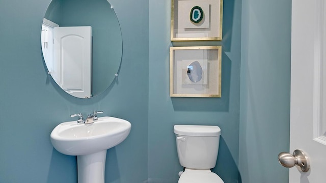 bathroom with sink and toilet