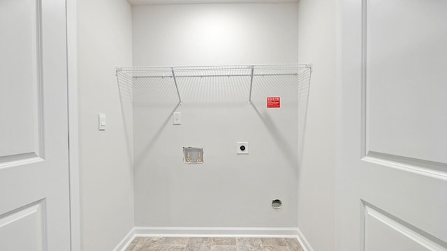 washroom with hookup for an electric dryer and hookup for a washing machine