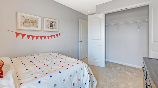 carpeted bedroom featuring a closet