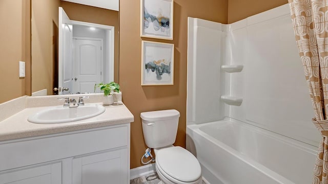 full bathroom featuring bathing tub / shower combination, vanity, and toilet