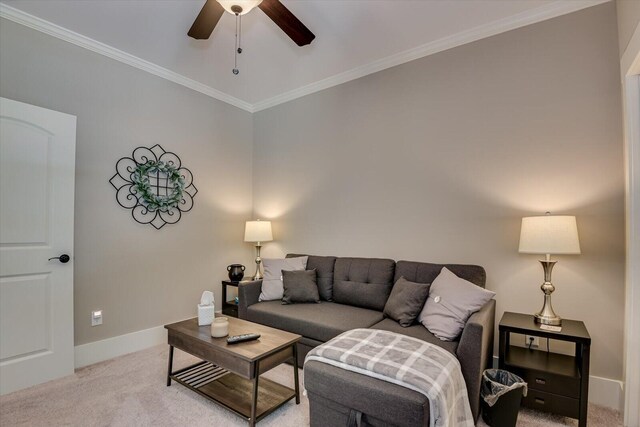 living room featuring ceiling fan, light colored carpet, and crown molding