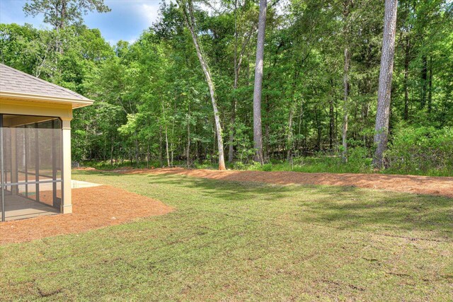 view of yard featuring a sunroom