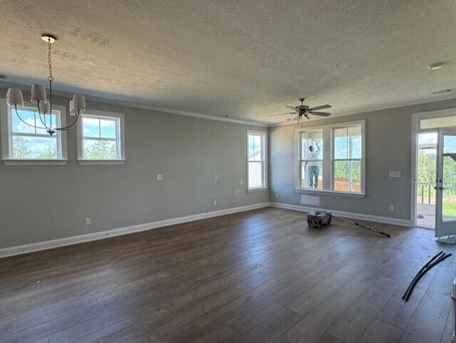 2142 Sinclair Dr Unit Sc86, Grovetown, GA 30813 - unfurnished room featuring a textured ceiling, baseboards, dark wood-style floors, plenty of natural light, and a chandelier