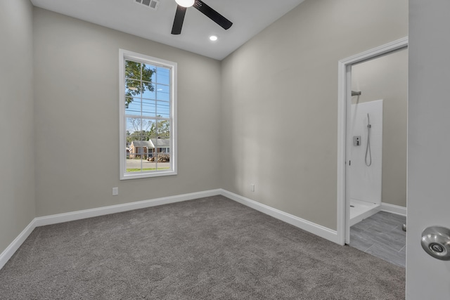 unfurnished room with ceiling fan and carpet floors